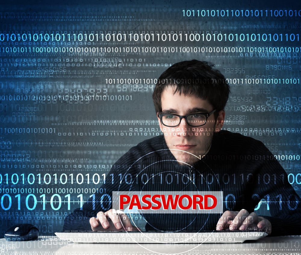 Young geek hacker stealing password on futuristic background